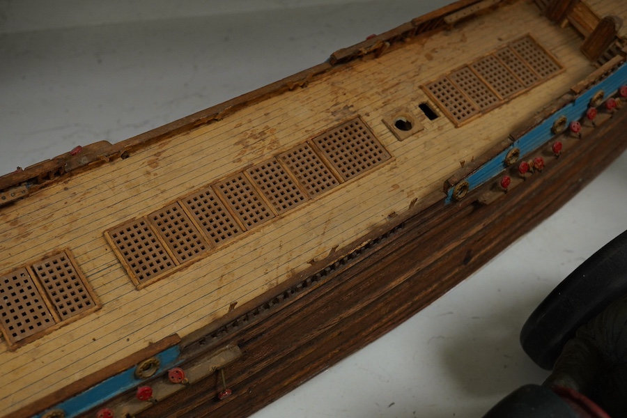 A scratch built model of a ship and a toy racing car and driver, ship 89cm wide. Condition - poor